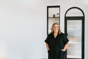 This is a photo from the ebb&flow Design branding shoot that showcases their team and some of their furniture and materials.