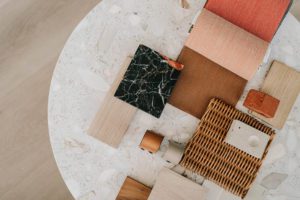This is a photo from the ebb&flow Design branding shoot that showcases their team and some of their furniture and materials.