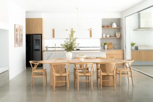 A modern kitchen and dining area.
