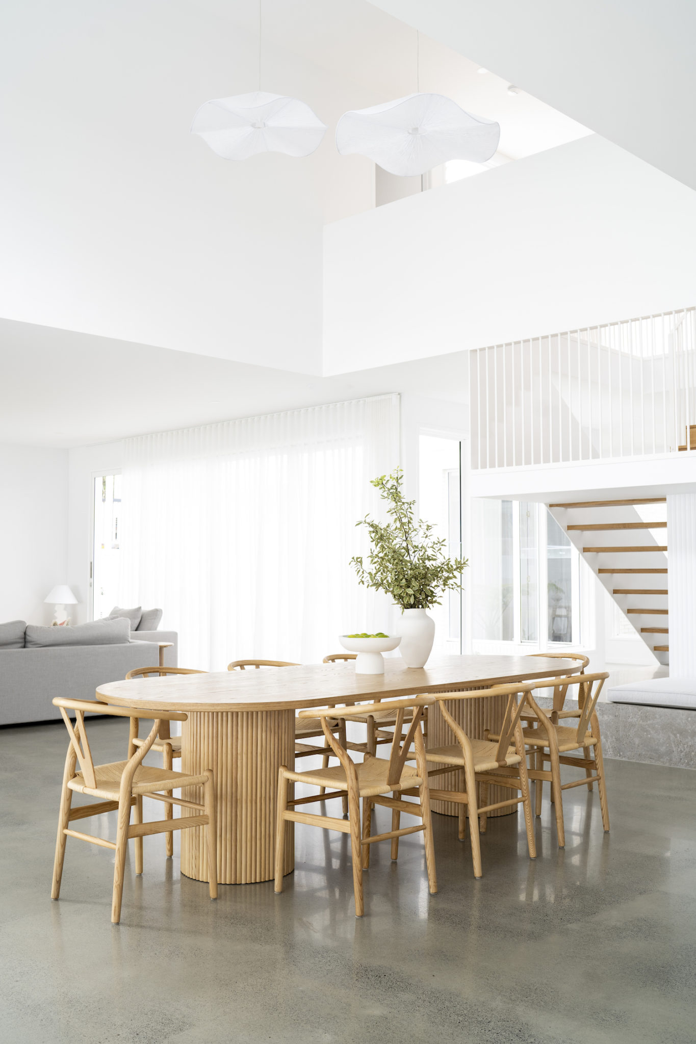 A modern home with concrete floors and white walls.