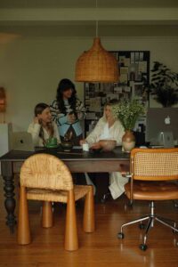 The wholehearted in house studio team are working together at their desk in the studio.
