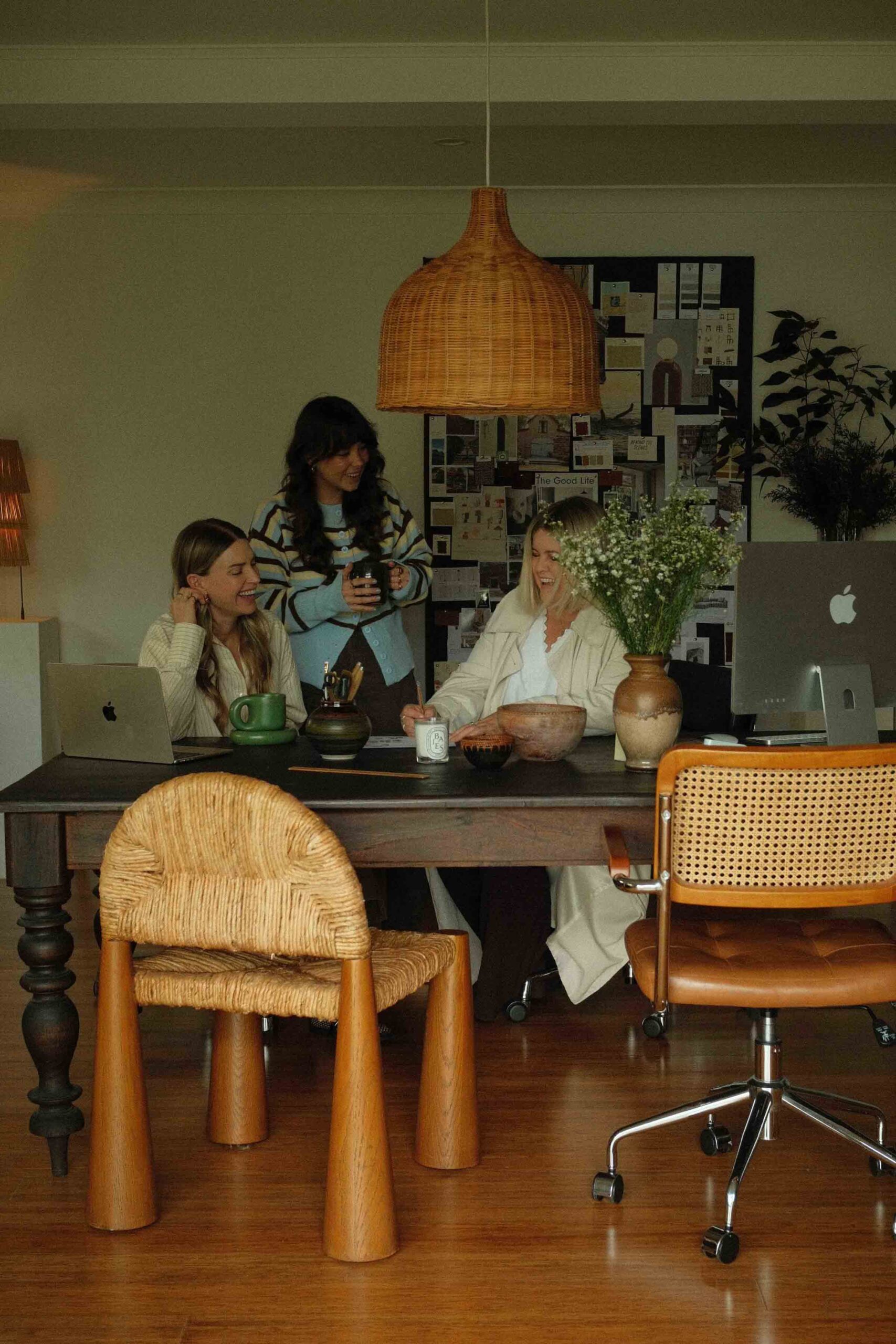 The wholehearted in house studio team are working together at their desk in the studio.