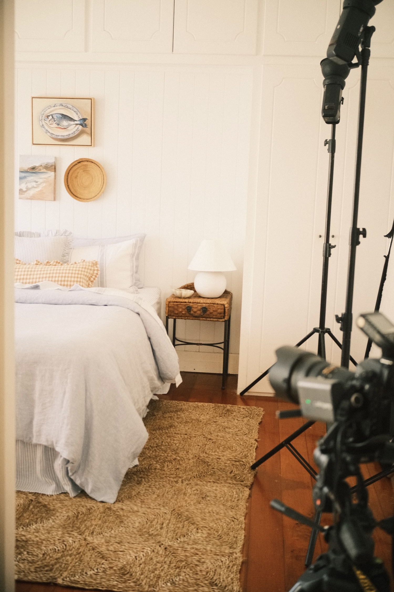 The primary room of a country style Queenslander home with camera equipment off to the right side of the shot.