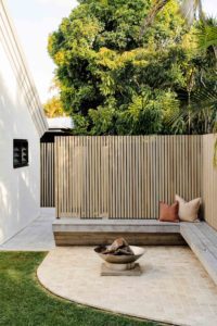 A fire pit and bench seat area.