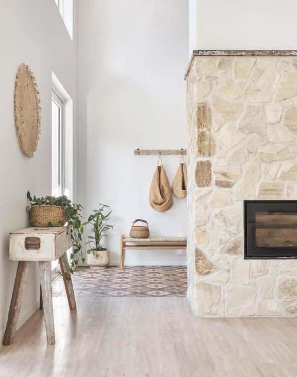 Stone fireplace and timber flooring.