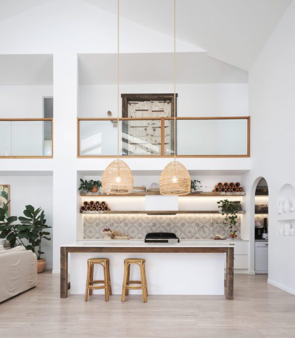 Bask El Sol's kitchen with two cane chairs tucked in under the counter.