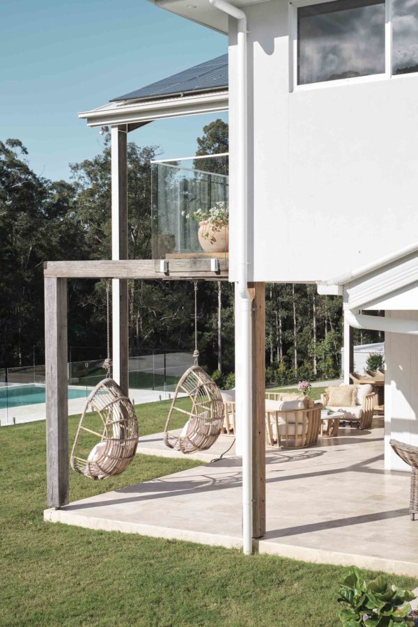 Bask El Sol's verandah, with tiles and hanging chairs.