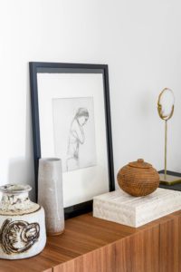 Vintage objects style an entertainment unit.