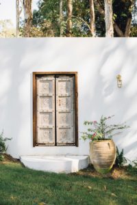 Bask El Sol backdrop of a vintage door.