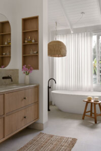 Sink and bath in the primary ensuite of a renovated country style Queenslander home.