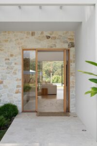 The entry and front exterior of a modern Palm Springs inspired home.