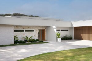 The entry and front exterior of a modern Palm Springs inspired home.