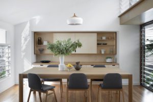 A modern dining room with a Jardan dining table and chairs.