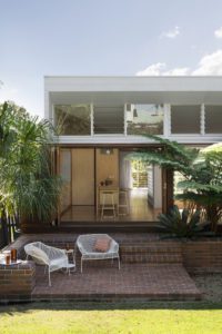The backyard facade of an extension of a Queenslander home.
