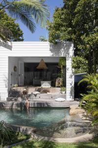 A kidney shaped pool in a Queenslander renovation.