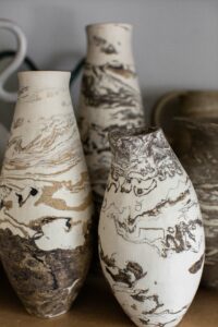 A close up of the marbled ceramic vases in the home studio of Nioka Clay.