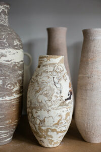 A close up of the marbled ceramic vases in the home studio of Nioka Clay.