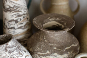 A close up of the marbled ceramic vases in the home studio of Nioka Clay.