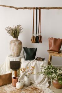 A collection of handmade bags styled for a photo shoot.