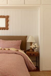 Shot of a bed, styled with Pinot Gingham and Yellow Stripe bed linen.