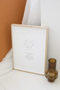A Be Wholehearted Mantra Print in an oak frame.