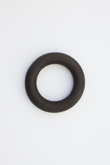 A round doughnut shaped object for styling coffee tables.