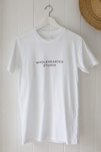 A t-shirt with Wholehearted Studio printed on it.