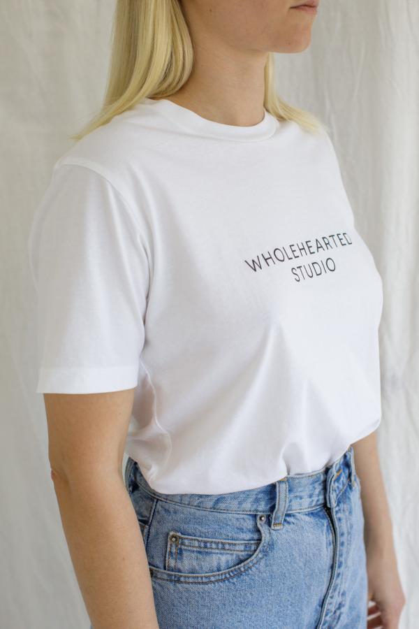 A t-shirt with Wholehearted Studio printed on it.